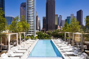 Pool side Kettal loungers and private cabanas